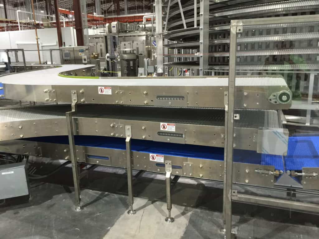 Long belt conveyor line installed in a commercial bakery plant